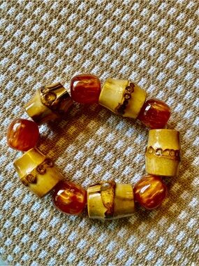 Amber colored beads and bamboo Stretch Bracelet fun transition piece approx 7”
